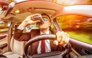 drunk-man-in-a-suit-and-sunglasses-driving-on-a-road-in-the-car-vehicle