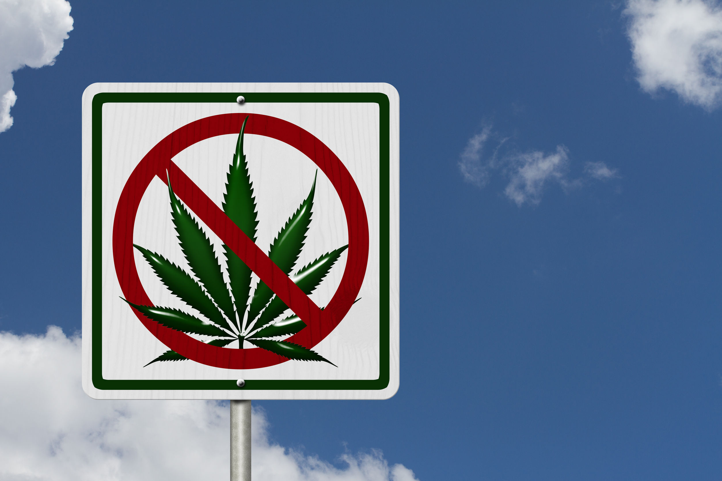 Driving Under the Influence of Marijuana, A road highway sign with a marijuana leaf with sky background