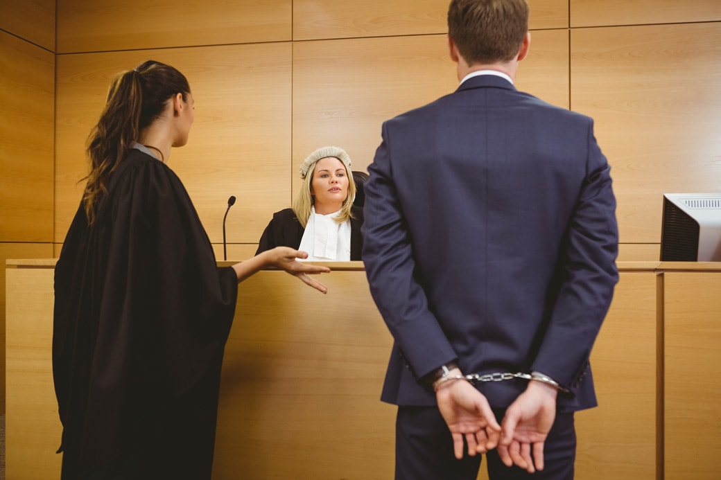 judge-talking-with-the-criminal-in-handcuffs-in-the-court-room